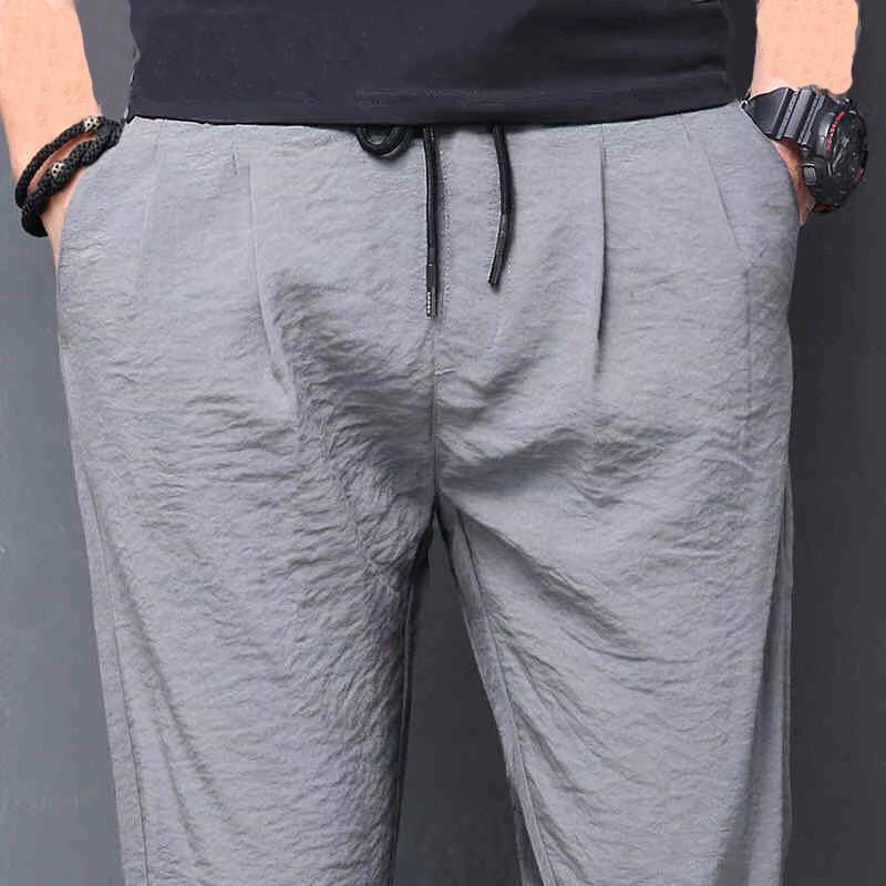 Pantalones largos de verano de seda de hielo para hombre.