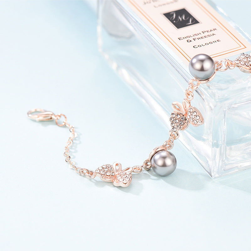 Alloy Bracelet With Rhinestones And Pearl Points