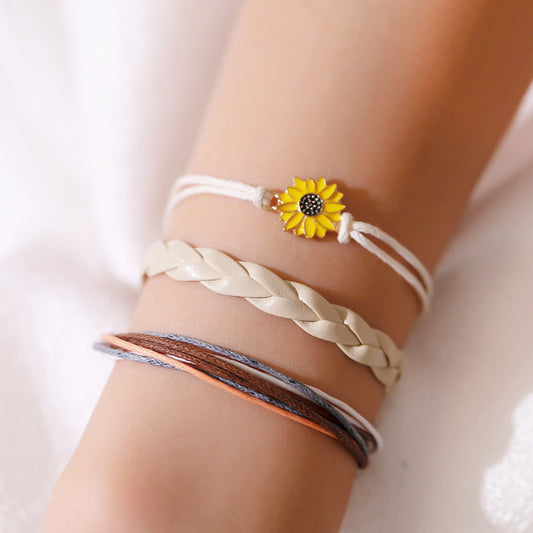 Bracelet petite marguerite en métal lisse tressé à la main