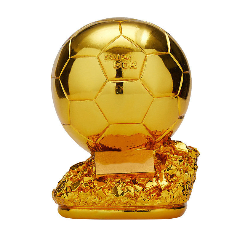 Mini trofeo de bola de oro para el ganador.