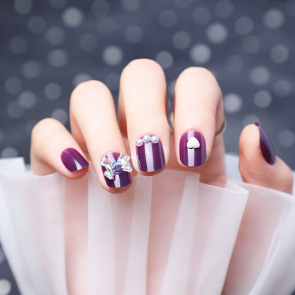 Wearing Nails With Diamonds And Purple Fake Nails